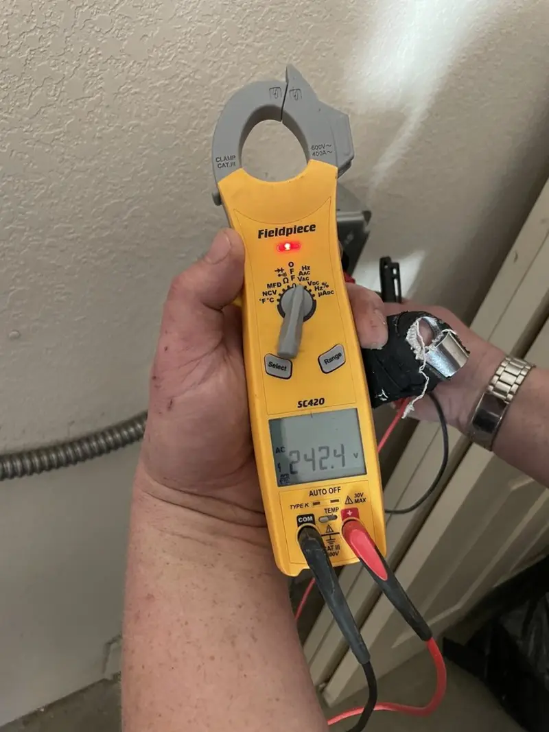 Voltage testing with clamp meter during Recessed Lighting Installation in Kaplan